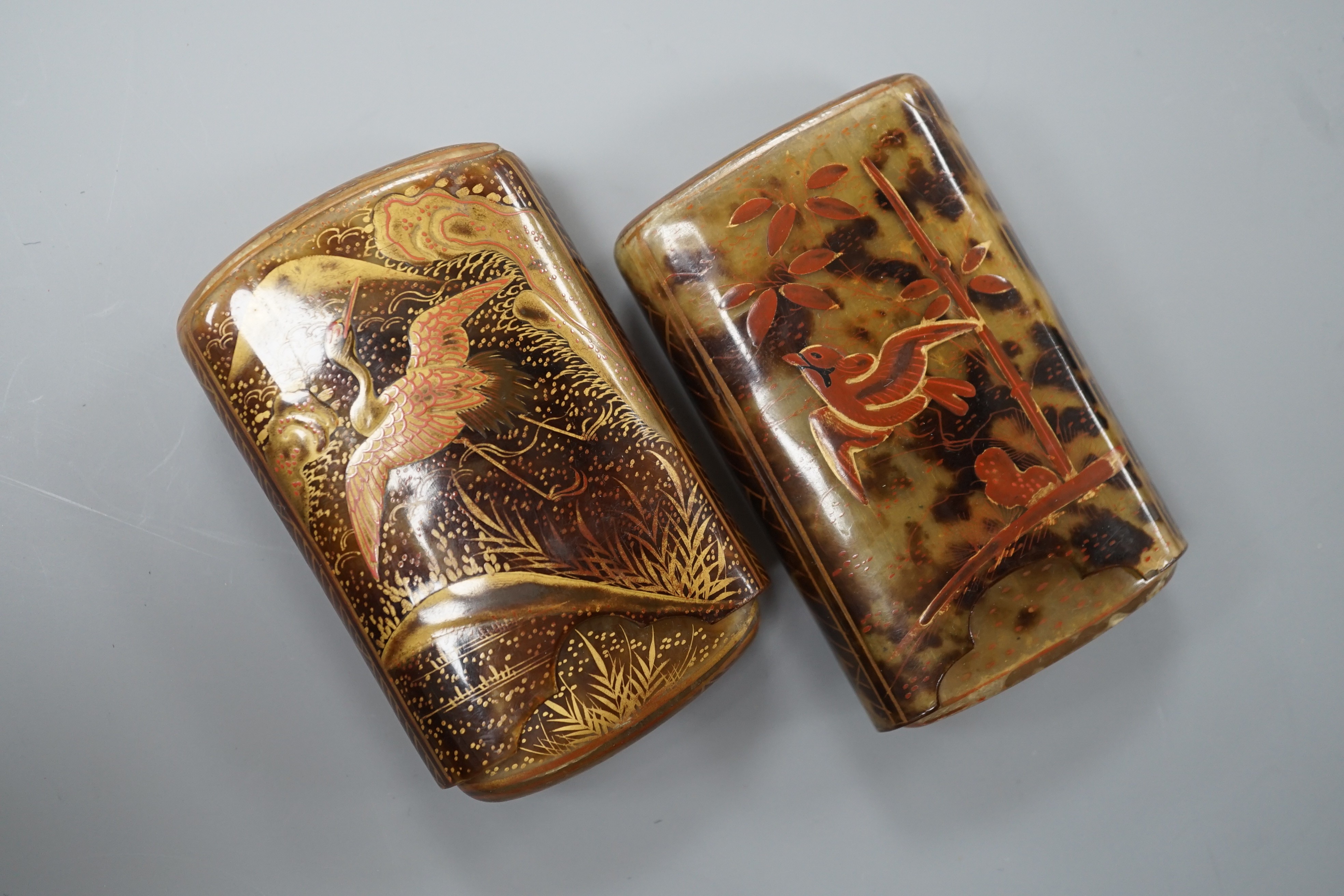 Two Japanese gilt lacquered tortoiseshell cigarette cases, 8 cm